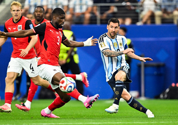 Lionel Messi in action with Austria's Kevin Danso
