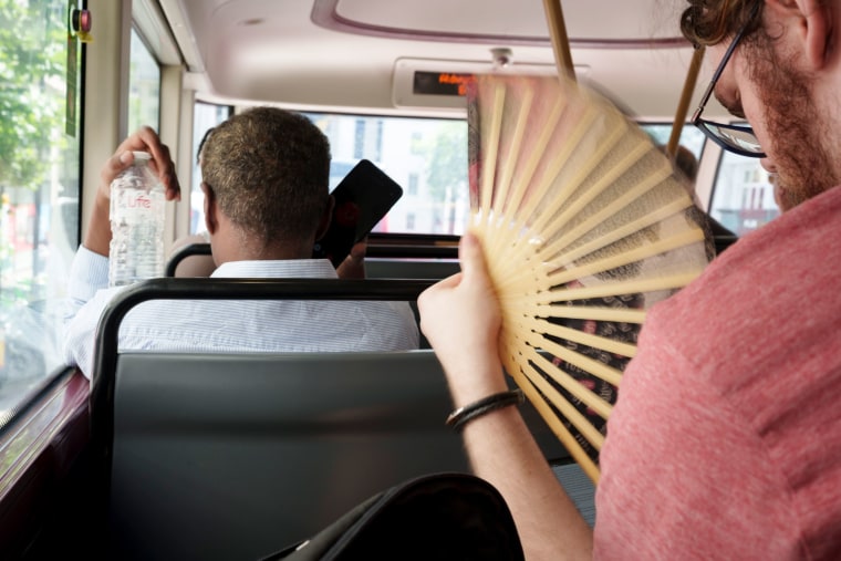 Bus passengers swelter during a heat wave in London on Monday.