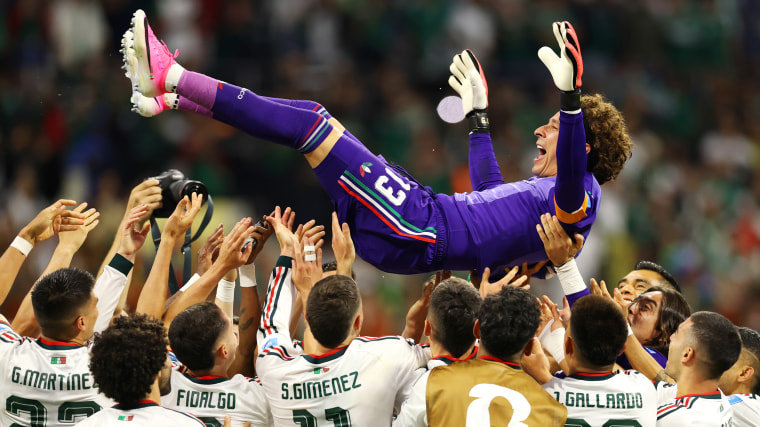 Guillermo Ochoa #13 of Mexico is tossed into the air by his teammates after the team's 3-0 victory.