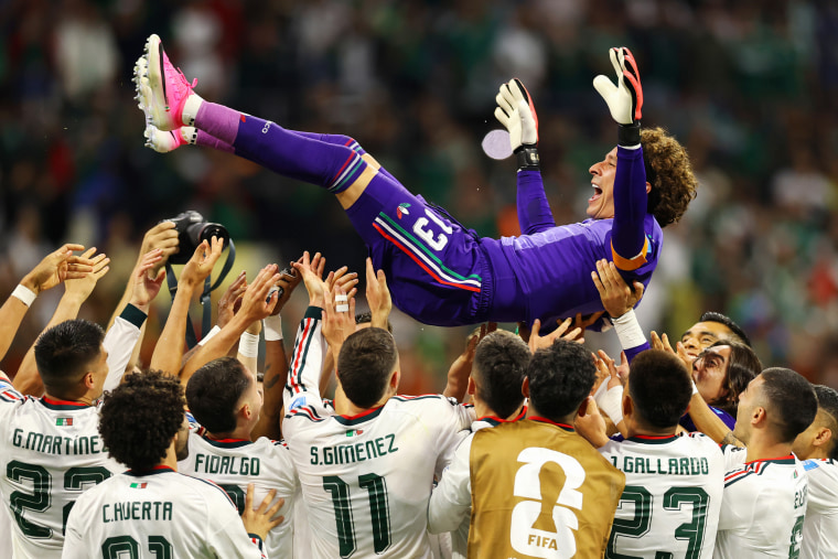 Guillermo Ochoa #13 of Mexico is tossed into the air by his teammates after the team's 3-0 victory.