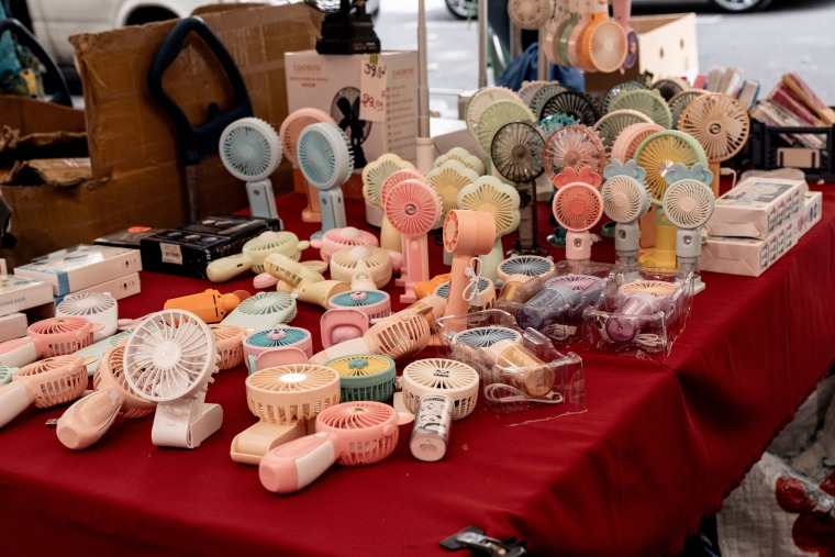 Electric hand fans for sale on a stall during high temperatures in the 18th arrondissement district of Paris, France, on Tuesday, June 23, 2026. 