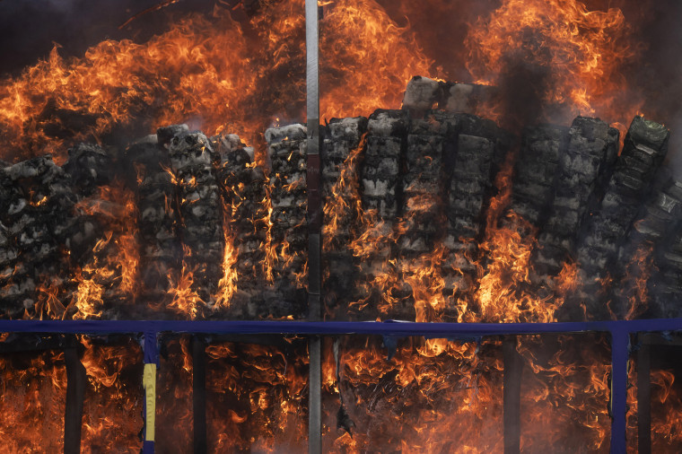 Illegal drugs are set on fire during a destruction ceremony to mark the United Nations' "International Day against Drug Abuse and Illicit Trafficking" in Yangon, Myanmar on June 26, 2026. 