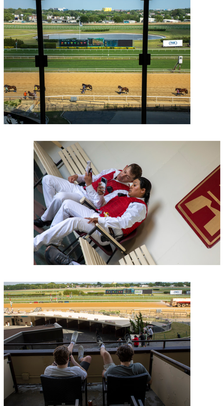 Horses are escorted onto the track; labor look astatine their phones; 2 fans put their legs up successful the grandstand overlooking the track.