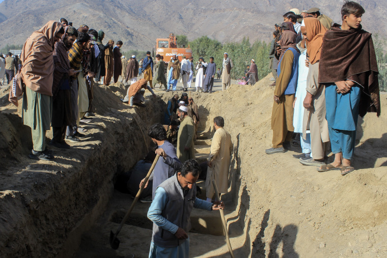 A mass grave being dug in the high desert of Afghanistan.