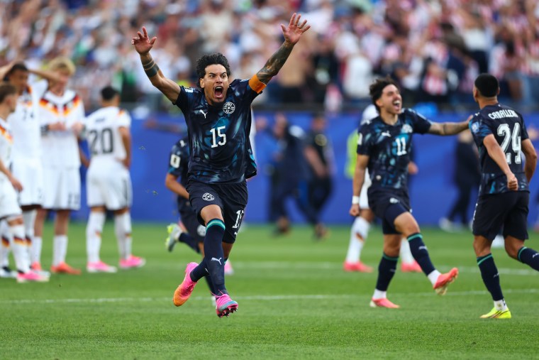 Gustavo Gomez #15 of Paraguay celebrates after Jose Canale #13 scores the winning penalty during Germany v Paraguay match.