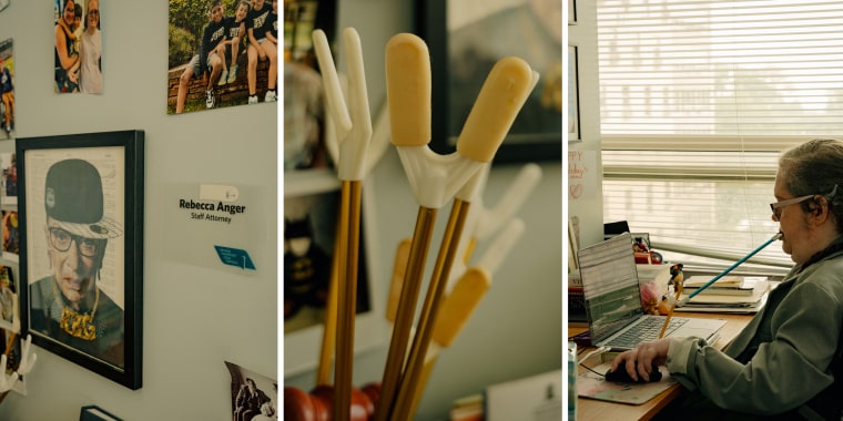 A split composite image: photo on the left shows a framed picture of Ruth Bader Ginsburg wearing a baseball cap next to a label that reads "Rebecca Anger, Staff Attorney", in the middle photo - assistive devices, two prongs attached to long handles gathered together, and photo on the right shows Rebecca using the devices, controlled by her mouth, to do work on her laptop