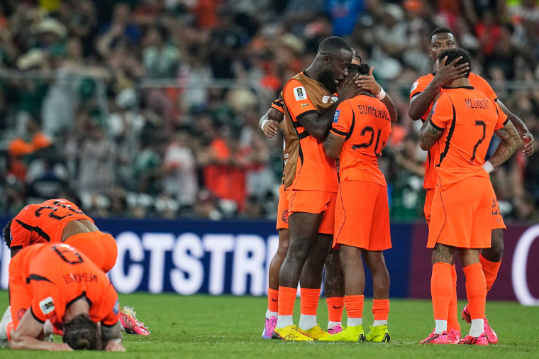 Image: Netherlands players react to their soccer match loss