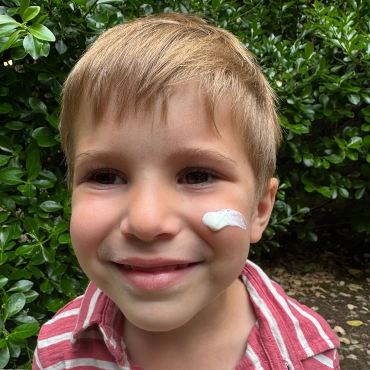 Child with sunscreen on face