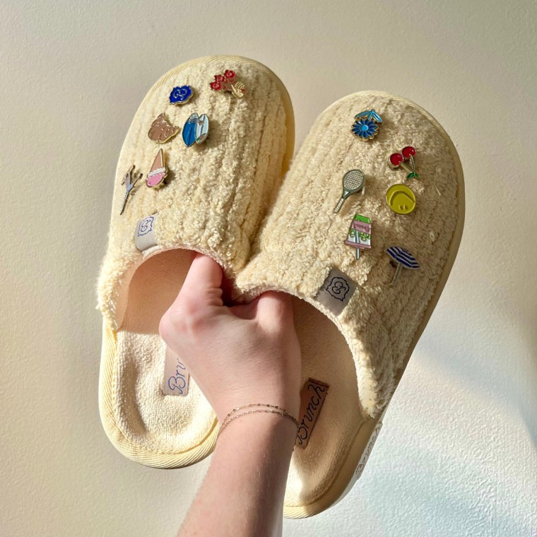 Associate market editor Audrey Ekman customizes her Brunch slippers with an assortment of summer charms.