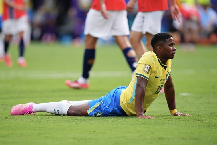 Endrick splayed on his stomach on the soccer pitch, his eyes closed.