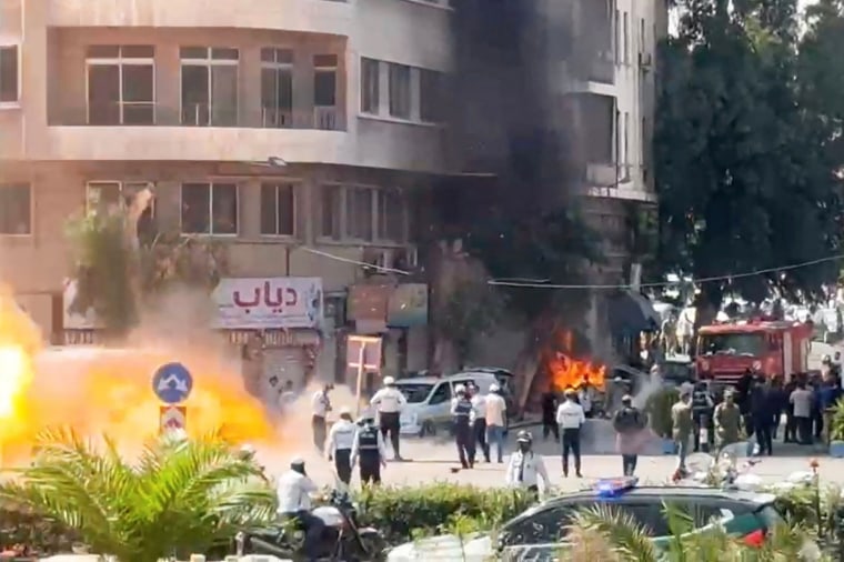 Explosive devices blow up near a hotel where French President Emmanuel Macron was meant to be staying, in Damascus