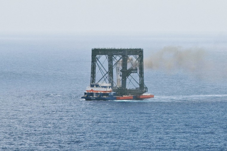 The returned first stage of a China's Long March-10B carrier rocket is successfully captured on a seaborne platform via a net-capture system on July 10, 2026.
