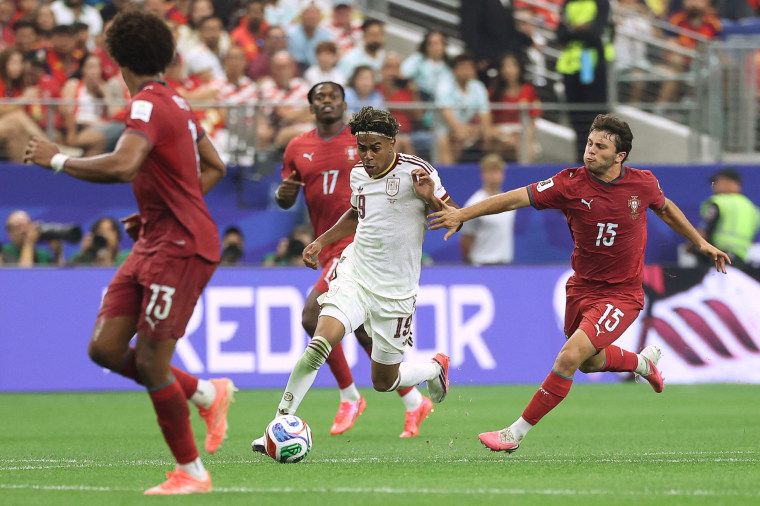 Spain's Lamine Yamal and Portugal's Joao Neves fight for the ball on July 6, 2026.