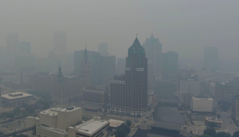 Smoke from wildfires in Canada and northern Minnesota hangs over downtown Milwaukee on July 16, 2026.