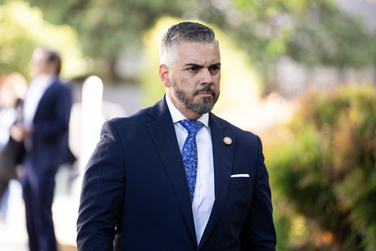 Rep. Juan Ciscomani walking outdoors.