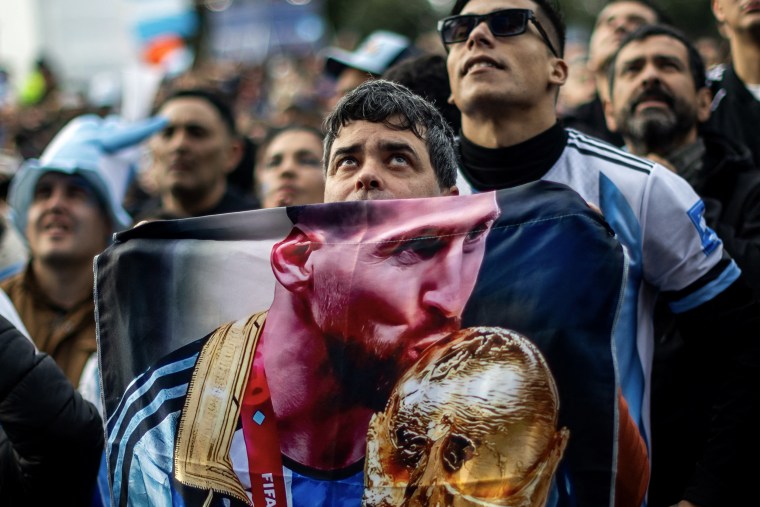 Soccer fans at an outdoor watch party during the world cup/