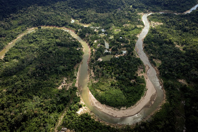 An aerial view of a winding river in the Amazon.