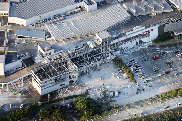  Photo taken from a Kyodo News helicopter on July 28, 2026, shows a partially destroyed Aeon Mall building in Kashima, Kumamoto Prefecture
