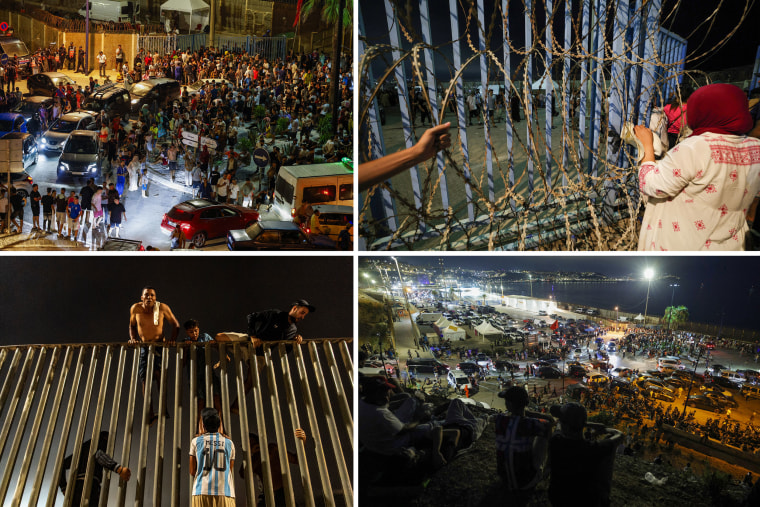 People gather at Bab Sebta, on the Morocco-Spain border near Spain's enclave of Ceuta and the Moroccan town of Fnideq, on Thursday.