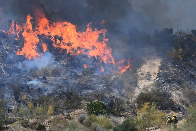 Firefighters work to extinguish a wildfire near Bedar, Spain, on July 10, 2026. 