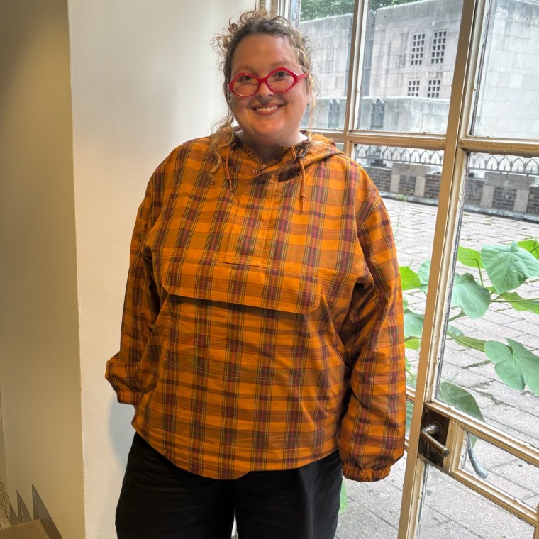 Associate editor Annie Shigo in the GU Unisex Checked Half Zip Parka.
