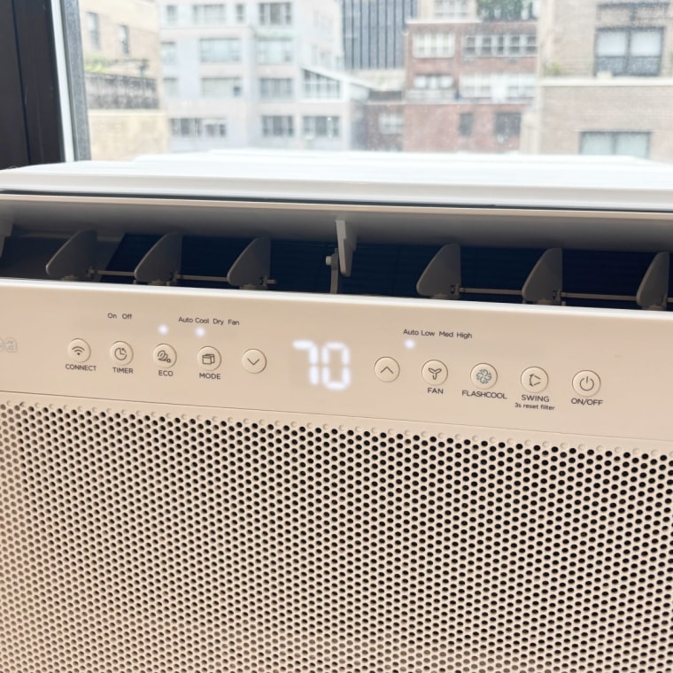 A close-up image of the Midea U-Shaped Smart Window Air Conditioner’s control panel and vents.