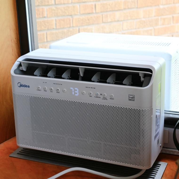 A Midea U-Shaped Smart Window Air Conditioner installed.