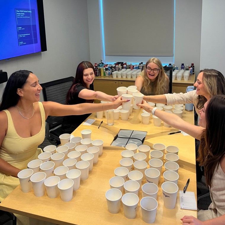 Testers cheersing before starting their first round of tasting.