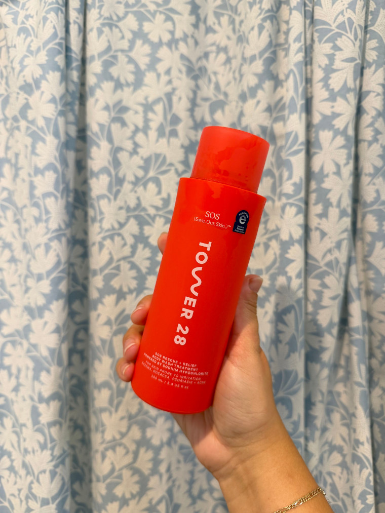 Person holding SOS Rescue + Relief Body Wash Treatment