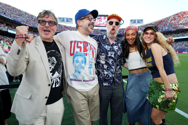 The "Ted Lasso" cast — Jeremy Swift, Jason Sudeikis, Brendan Hunt, Abbie Hern and Juno Temple — at the Argentina and Switzerland match at Kansas City Stadium on July 11, 2026.