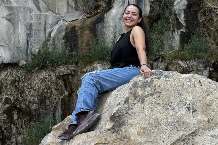 Ashley Garibay posing on a rock.