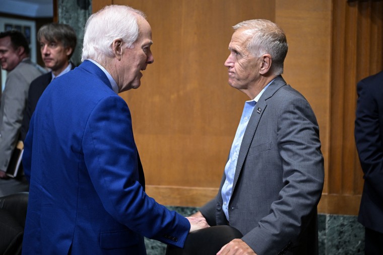 Sen. John Cornyn, R-Texas, left, speaks with Sen. Thom Tillis, R-N.C., during a Senate Finance Committee hearing on July 30, 2026.