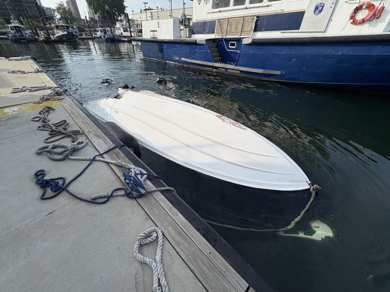 The capsized Vessel, tied to a pier after the capsizing, on Aug. 8, 2026.