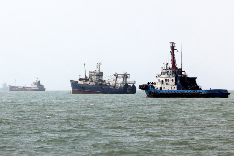 Three ships in a row on the water