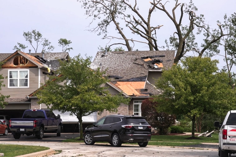 a roof is damaged after a strong storm in Tinley Park, Ill.