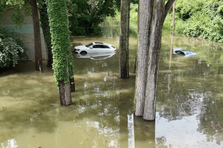 Residents posted videos on social media that showed vehicles stranded in high water, a power pole being toppled by rushing water and flooded intersections.