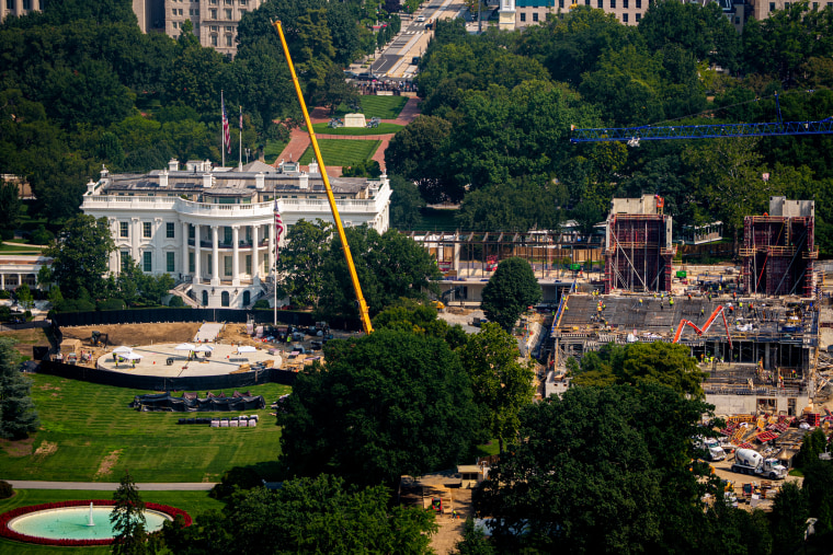 Construction continues on a new helipad on the South Lawn of the White House and the East Wing ballroom.