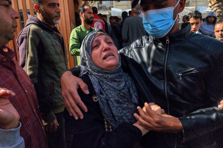 A woman mourns.