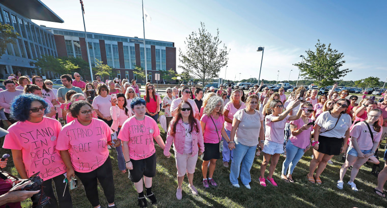 Vigil organizer Renee Kimball, of Maine, gathers Lindsay Clancy supporters in a circle for a moment of silence at a vigil