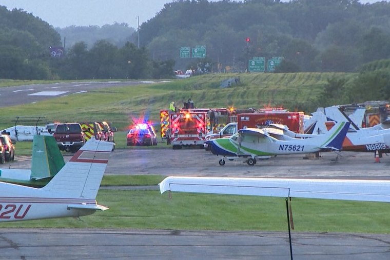 First responders gather at Carlisle Airport in Carlisle, Pennsylvania, following a fatal crash between a small plane and a state police helicopter on Wednesday.
