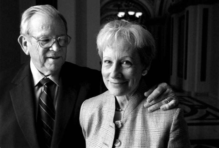 A black and white photo of Howard Baker with his arm around Nancy Kassebaum's shoulder.
