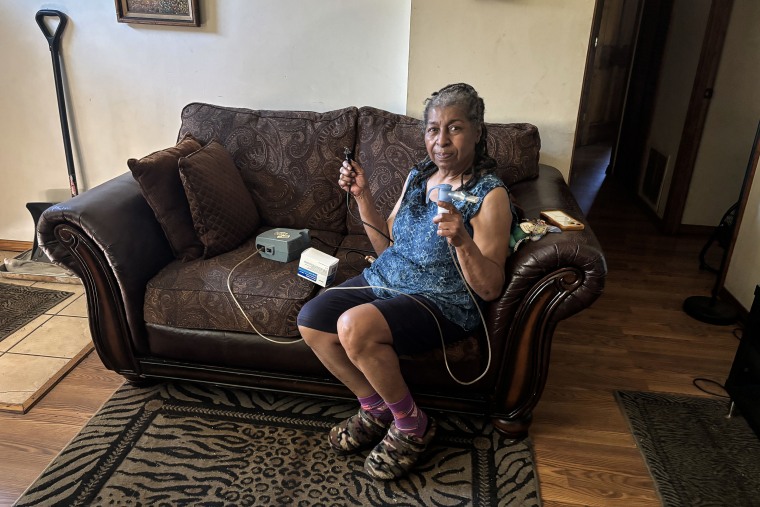 Lifelong Gary, Ind., resident Joetta Walker, 73, holds her breathing machine.