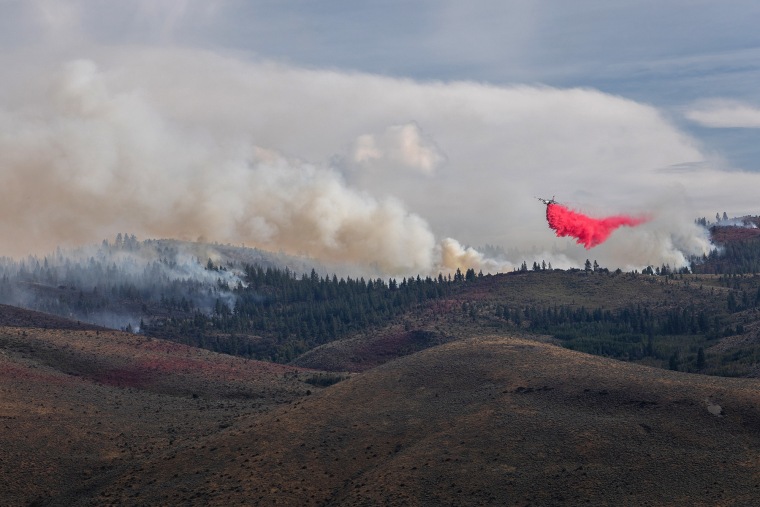 An aircraft drops fire retardant on the Hawk Fire in Reno, Nev.