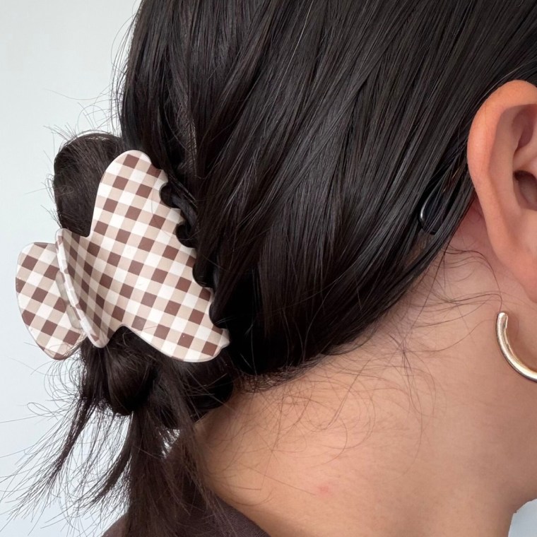 Woman wearing a gingham-printed claw clip.