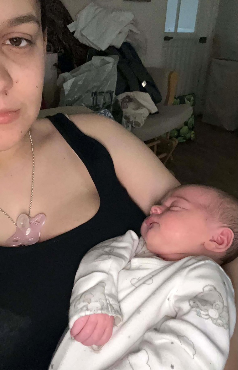 Image: A selfie photo of Sofii holding her baby Evie