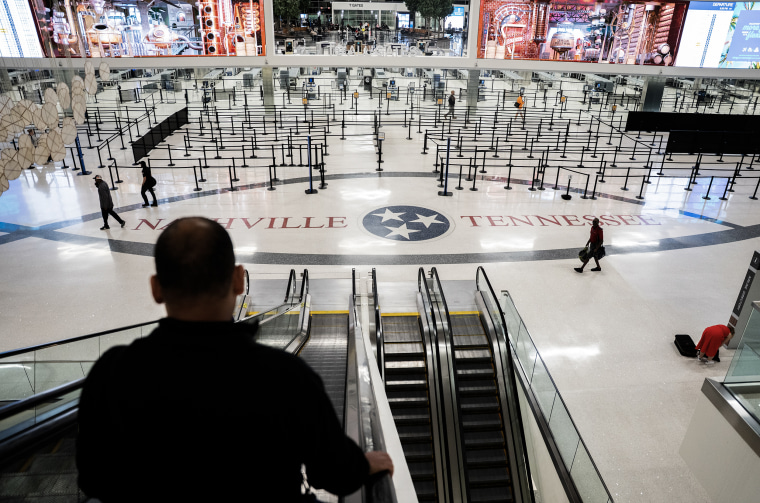 Empty lines inside an airport terminal with NASHVILLE TENNESSEE written on the floor.