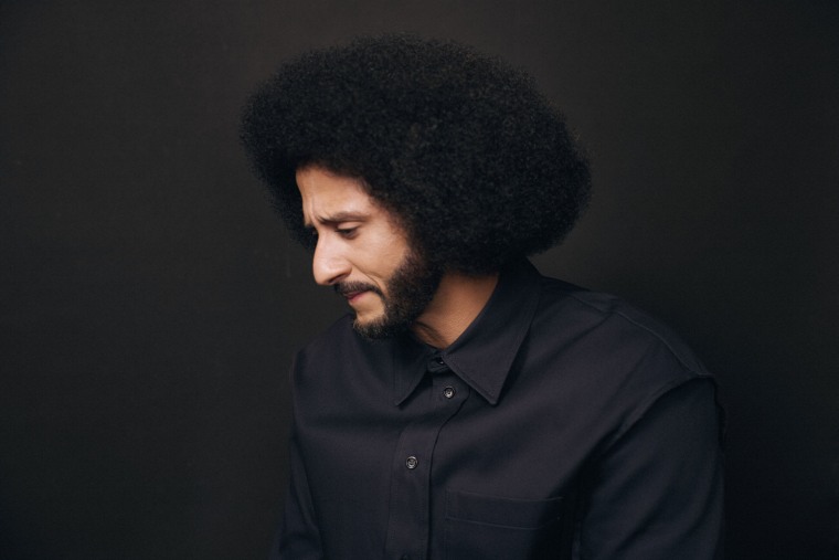 Colin Kaepernick looking down