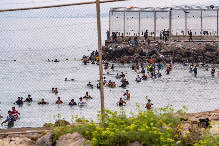 Migrants attempting to cross from Morocco to Ceuta on July 31.