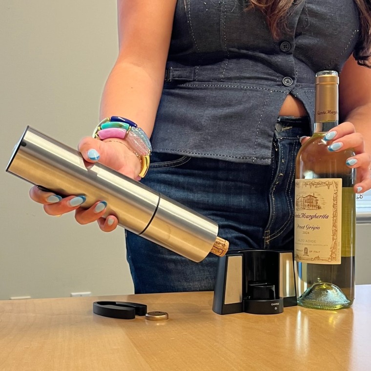 The Cuisinart wine opener ejects the fully-removed cork with the press of a button.