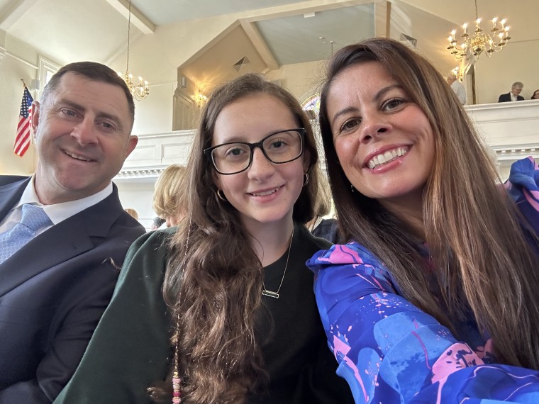 Harper Nickerson with her parents.